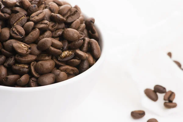 Bowl of caffee beans on a white background — Stock Photo, Image