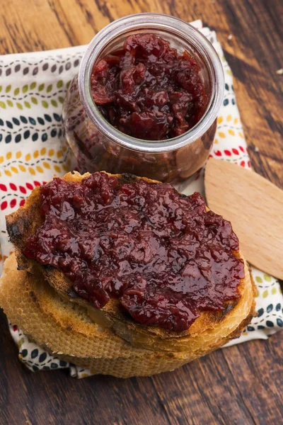 Bread with sweet cherry jam — Stock Photo, Image