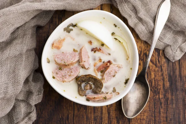 Traditional easter white borscht with eggs and sausage — Stock Photo, Image