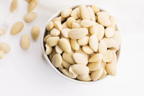 Bowl of almonds on a white background — Stock Photo, Image