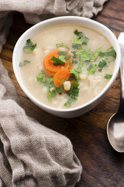 Barley soup, pearl barley in white bowl