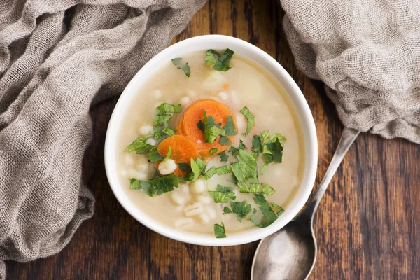 Barley soup, pearl barley in white bowl