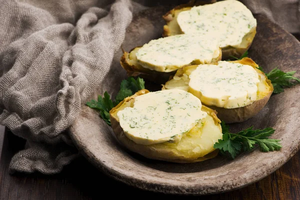 Baked potatoes with herbs butter — Stock Photo, Image