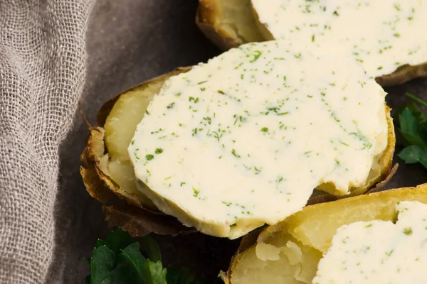 Baked potatoes with herbs butter — Stock Photo, Image