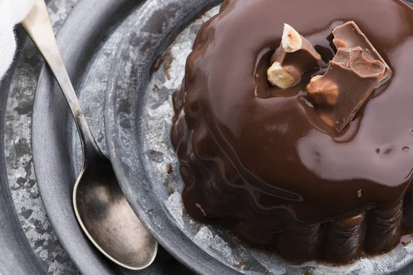 Chocolate pudding with chocolate dressing on a plate — Stock Photo, Image