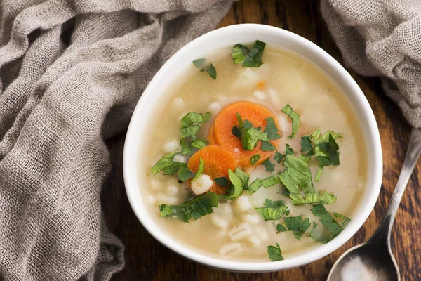 Barley soup, pearl barley in white bowl