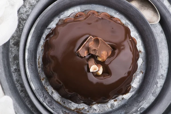 Chocolate pudding with chocolate dressing on a plate