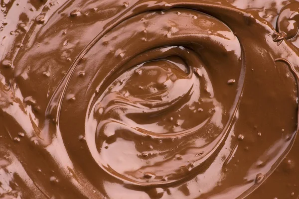 Расплавленный шоколадный фон. Крупный план — стоковое фото