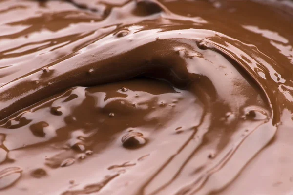 Fondo de chocolate derretido. Imagen de primer plano — Foto de Stock