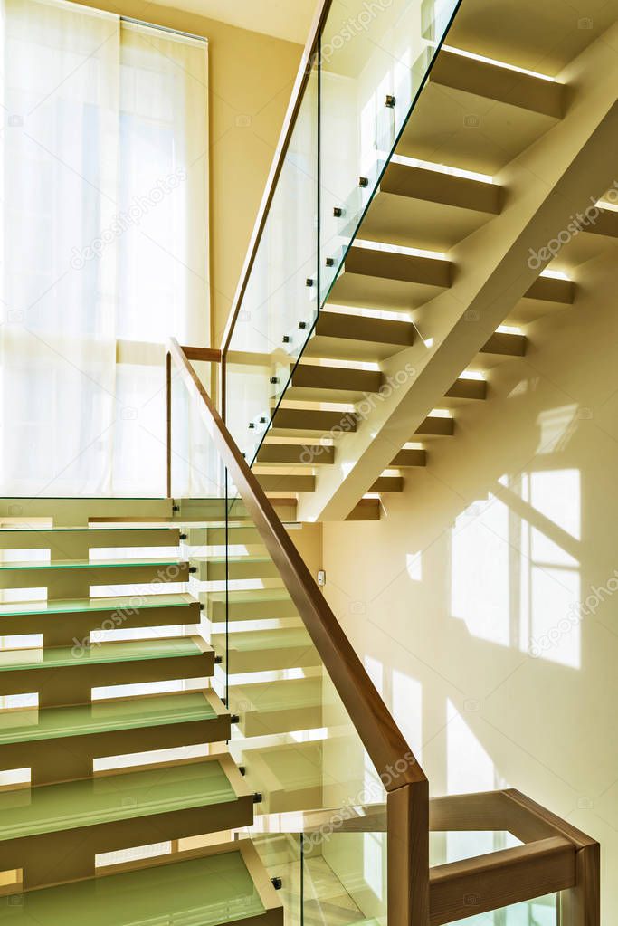 modern office interior with stairs and windows 