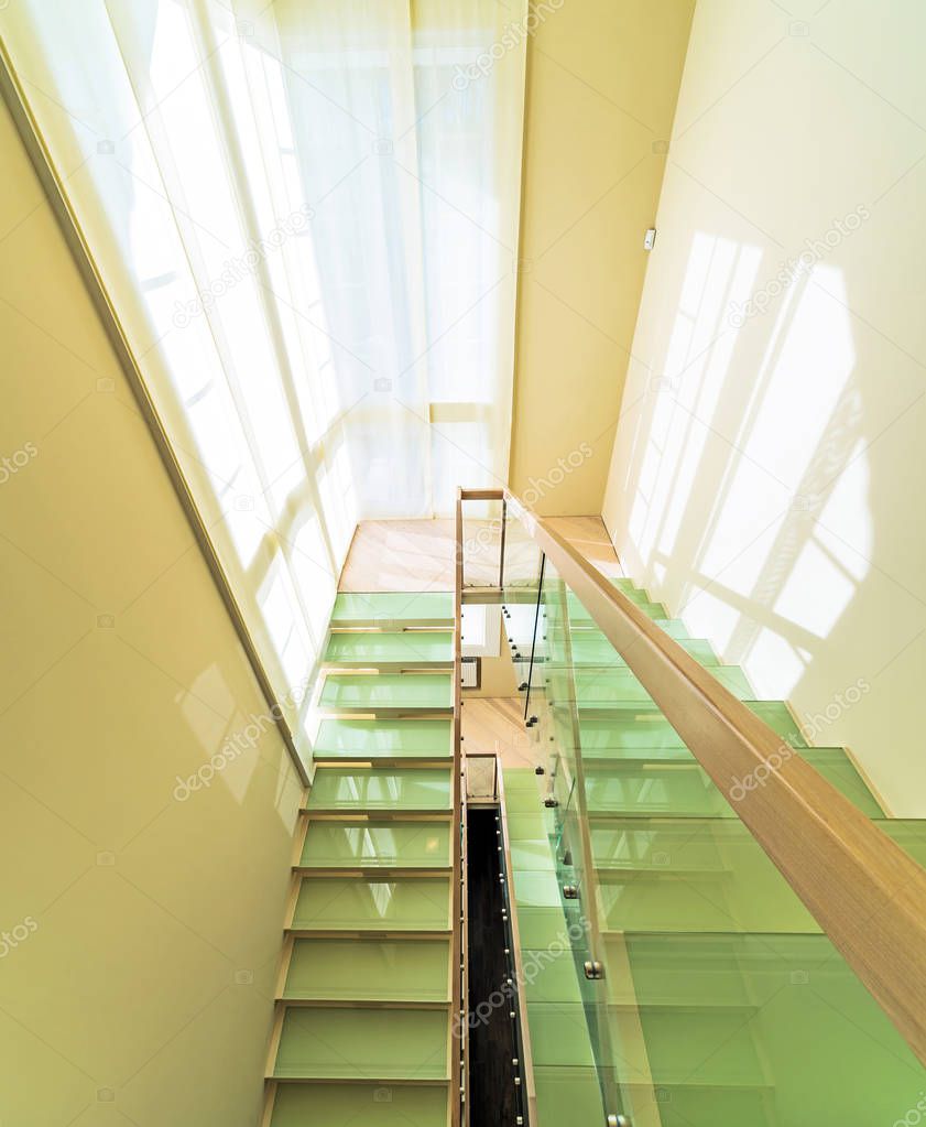 modern office interior with stairs and windows 