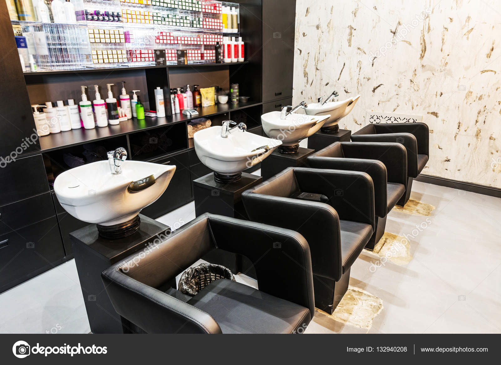 Beauty salon interior - a row of hair washing sinks Stock Photo by  ©baburkina 132940208