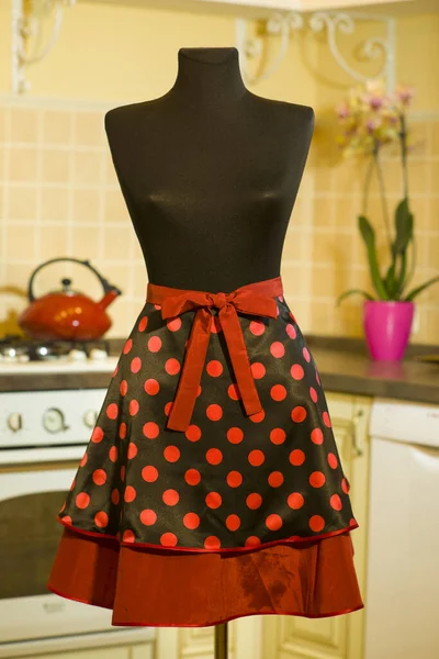 beautiful dress on a mannequin in the kitchen