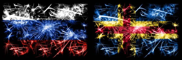 Rússia, Rússia vs Aland celebração Ano Novo fogos de artifício cintilantes fundo conceito bandeiras. Combinação de dois pavilhões dos Estados — Fotografia de Stock