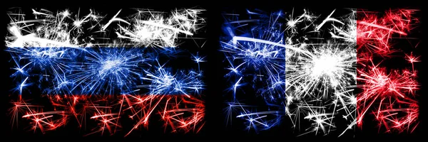 ロシア、ロシア対フランス、フランスの新年のお祝い輝く花火の旗のコンセプトの背景。2つの州旗の組み合わせ — ストック写真