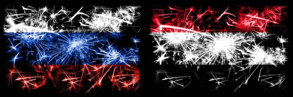 ロシア、ロシア対イエメン、イエメン新年のお祝い輝く花火の旗の概念の背景。2つの州旗の組み合わせ — ストック写真