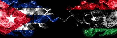 Küba, Kübalı Libya 'ya karşı Libya' nın yan yana yerleştirilmiş dumanlı mistik bayrakları. Kalın renkli ipeksi seyahat, soyut sigara sancakları..
