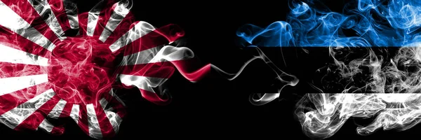 Japan opkomende zon marine vs Estland, Estse rokerige mystieke vlaggen naast elkaar geplaatst. Dikke gekleurde zijdezacht reizen abstracte rookt spandoeken — Stockfoto