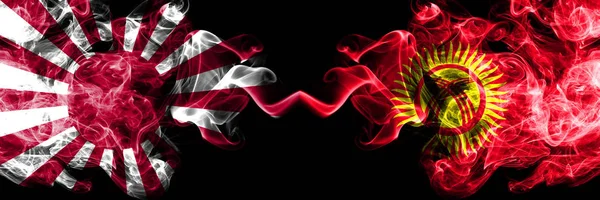 Japan rising sun naval vs Kyrgyzstan smoky mystic flags placed side by side. Thick colored silky travel abstract smokes banners — Stock Photo, Image