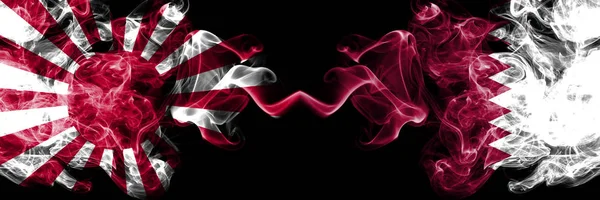 Japan rising sun naval vs Qatar, Qatari smoky mystic flags placed side by side. Thick colored silky travel abstract smokes banners — Stock Photo, Image