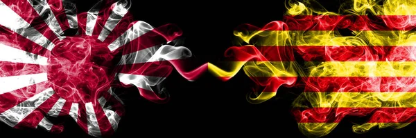 Japan rising sun naval vs Spain, Catalonia, Catalan, Senyera smoky mystic flags placed side by side. Thick colored silky travel abstract smokes banners — Stock Photo, Image