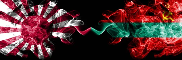 Japan rising sun naval vs Transnistria smoky mystic flags placed side by side. Thick colored silky travel abstract smokes banners
