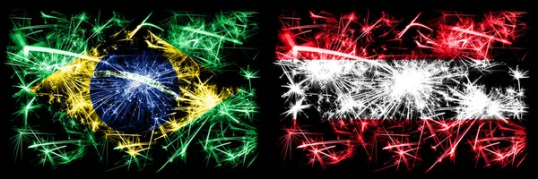 Brasil, Brasil vs Áustria, celebração do Ano Novo Austríaco fogos de artifício espumantes bandeiras fundo conceito. Combinação de dois pavilhões dos Estados — Fotografia de Stock