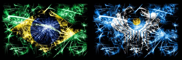Brazil, Brazilian vs Commonwealth New Year celebration sparkling fireworks flags concept background. Combination of two states flags — Stock Photo, Image