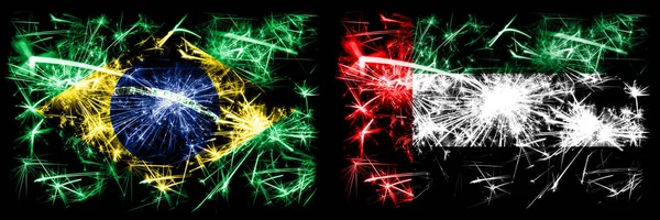 Brazil, Brazilian vs United Arab Emirates, Emirati New Year celebration sparkling fireworks flags concept background. Combination of two states flags — Stock Photo, Image