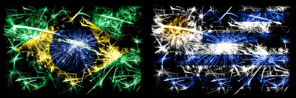 Brazil, Brazilian vs Uruguay, Uruguayan New Year celebration sparkling fireworks flags concept background. Combination of two states flags — Stock Photo, Image