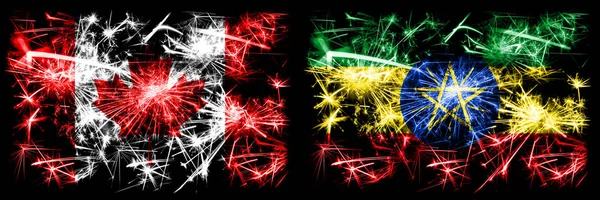 캐나다, 캐나다, 에티오피아, 에티오피아의 새해 기념행사 화려 한 불꽃놀이 플래그 배경. 두 개의 추상 국가가 결합 된 깃발 — 스톡 사진