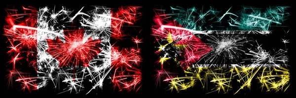 Kanada, Kanada vs Mosambik, Mosambik Neujahrsfeier funkelnden Feuerwerk Flaggen Konzept Hintergrund. Kombination aus zwei abstrakten Staaten Flaggen — Stockfoto