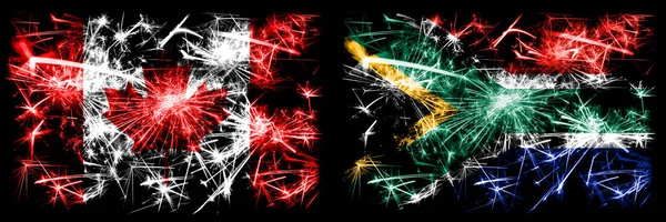 캐나다, 캐나다, 남아프리카 대남아프리카, 아프리카의 새해 축하 불꽃놀이 컨셉트 배경. 두 개의 추상 국가가 결합 된 깃발 — 스톡 사진