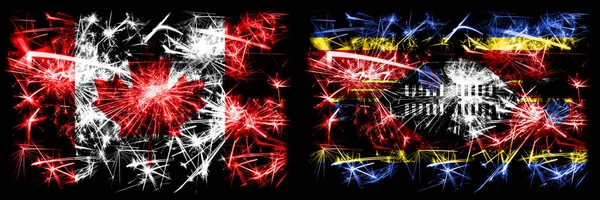 Canadá, Canadá vs Swazilandia, Swazilandia celebración de Año Nuevo brillante banderas de fuegos artificiales concepto de fondo. Combinación de dos banderas de estados abstractos —  Fotos de Stock