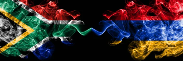 Zuid-Afrika vs Armenië, Armeense rokerige mystieke vlaggen naast elkaar geplaatst. Dikke gekleurde zijdeachtige abstracte rook vlaggen concept — Stockfoto