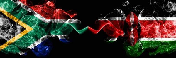 Dél-Afrika vs Kenya, Kenyai füstös misztikus zászlók egymás mellett. Vastag színű selymes elvont füst zászlók koncepció — Stock Fotó