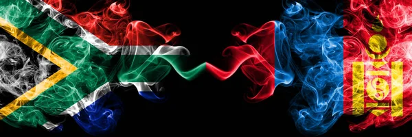 South Africa vs Mongolia, Mongolian smoky mystic flags placed side by side. Thick colored silky abstract smoke flags concept — Stock Photo, Image