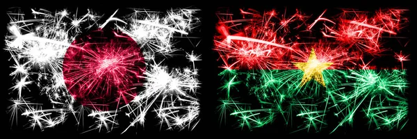 Japan, Japanese vs Burkina Faso New Year celebration sparkling fireworks flags concept background. Combination of two abstract states flags — Stock Photo, Image