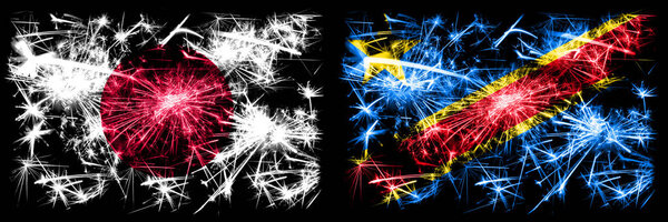 Япония, Япония против Демократической Республики Конго празднование Нового года искрящийся фейерверк флаги концепция фона. Сочетание двух абстрактных флагов состояний
