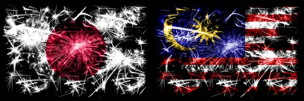 Japan, Japanese vs Malaysia, Malaysian New Year celebration sparkling fireworks flags concept background. Combination of two abstract states flags
