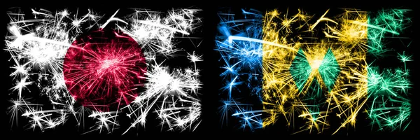 Japan, Japanese vs Saint Vincent and the Grenadines New Year celebration sparkling fireworks flags concept background. Combination of two abstract states flags — Stock Photo, Image