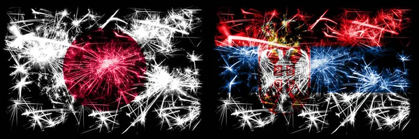 Japan, Japanese vs Serbia, Serbian New Year celebration sparkling fireworks flags concept background. Combination of two abstract states flags