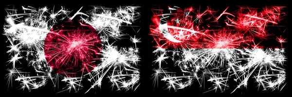 Japan, Japanese vs Singapore, Singaporean New Year celebration sparkling fireworks flags concept background. Combination of two abstract states flags