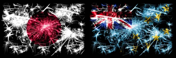 Japan, japan vs tuvalu, tuvaluan Neujahrsfeier funkelnden Feuerwerk Flaggen Konzept Hintergrund. Kombination aus zwei abstrakten Staaten Flaggen — Stockfoto