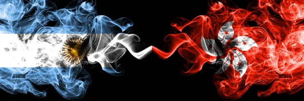 Argentina vs Hong Kong, China smoky mystic fire flags placed side by side. Thick colored silky abstract smoke flags concept — Stock Photo, Image