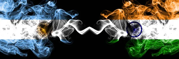Argentina vs India, Indian smoky mystic fire flags placed side by side. Thick colored silky abstract smoke flags concept