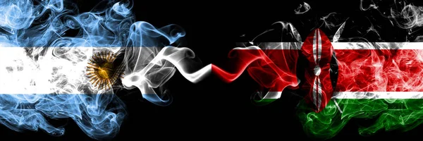 Argentina vs. Keňa, keňské kouřové mystické ohnivé vlajky umístěné bok po boku. Silné barevné hedvábné abstraktní kouřové vlajky koncept — Stock fotografie