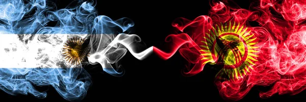 Argentina vs Kyrgyzstan smoky mystic fire flags placed side by side. Thick colored silky abstract smoke flags concept — Stock Photo, Image