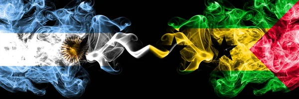 Argentina vs Sao Tome and Principe smoky mystic fire flags placed side by side. Thick colored silky abstract smoke flags concept — Stock Photo, Image