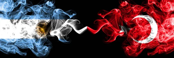 Argentina vs Turkey, Turkish smoky mystic fire flags placed side by side. Thick colored silky abstract smoke flags concept — Stock Photo, Image